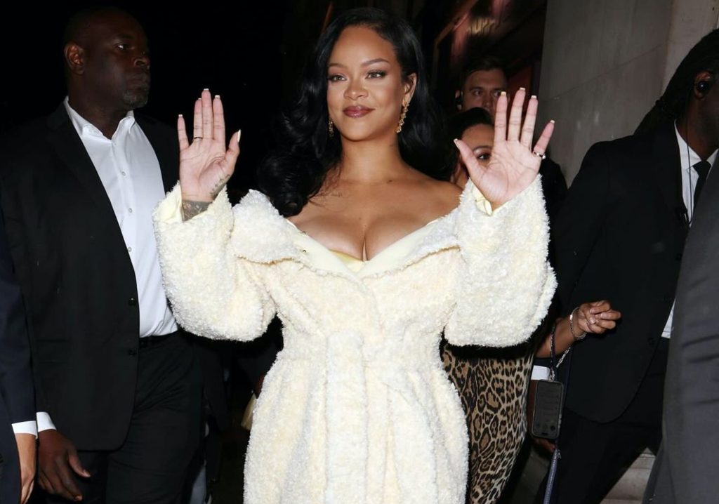 Rihanna Launches Fenty Hair in London in a Jacquemus Cream Coat, John Galliano SS 06 Ruffle Dress and Gold Custom Amina Muaddi Heels